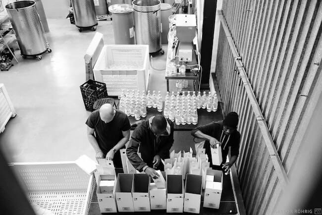 Packing Gin into boxes at Hope on Hopkins.