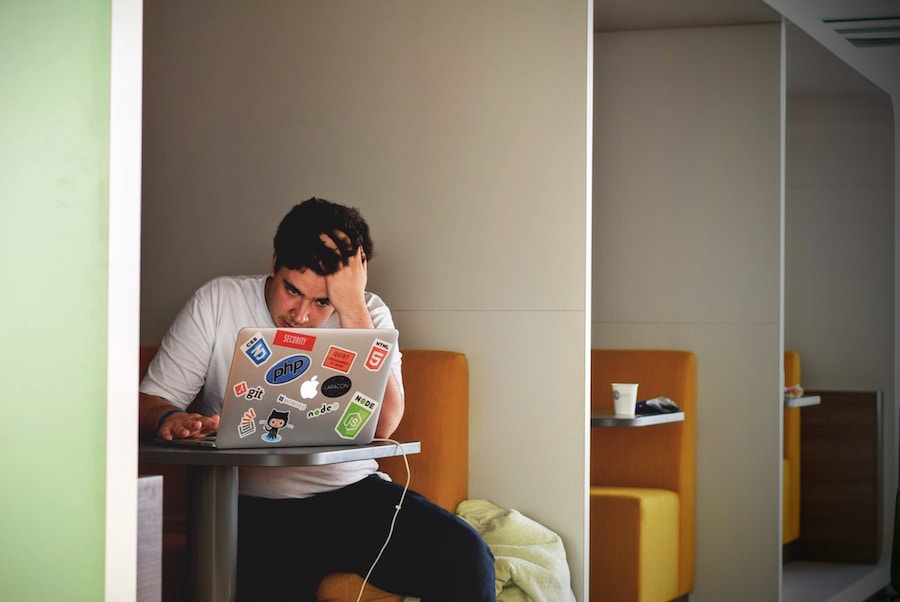 An image of a stressed man in an article on the effect your business may have on your health.