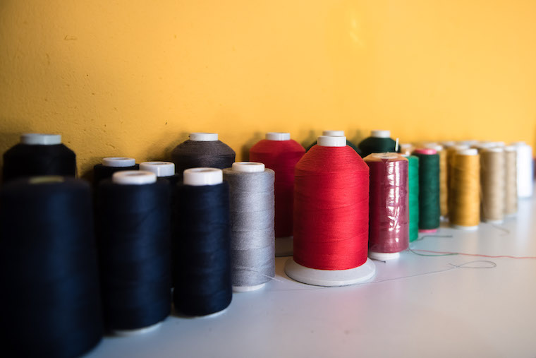 Cotton thread used for stitching the jeans.